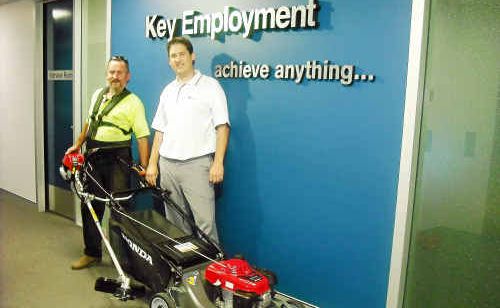 Steven Thomas with his new mower and brush cutter, presented to him by Key Employment consultant Steve Keenes. Steven Thomas with his new mower and brush cutter, presented to him by Key Employment consultant Steve Keenes.